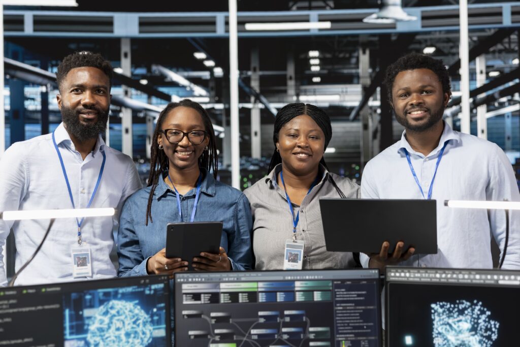 portrait happy server farm team looks data analysis graphs (1)